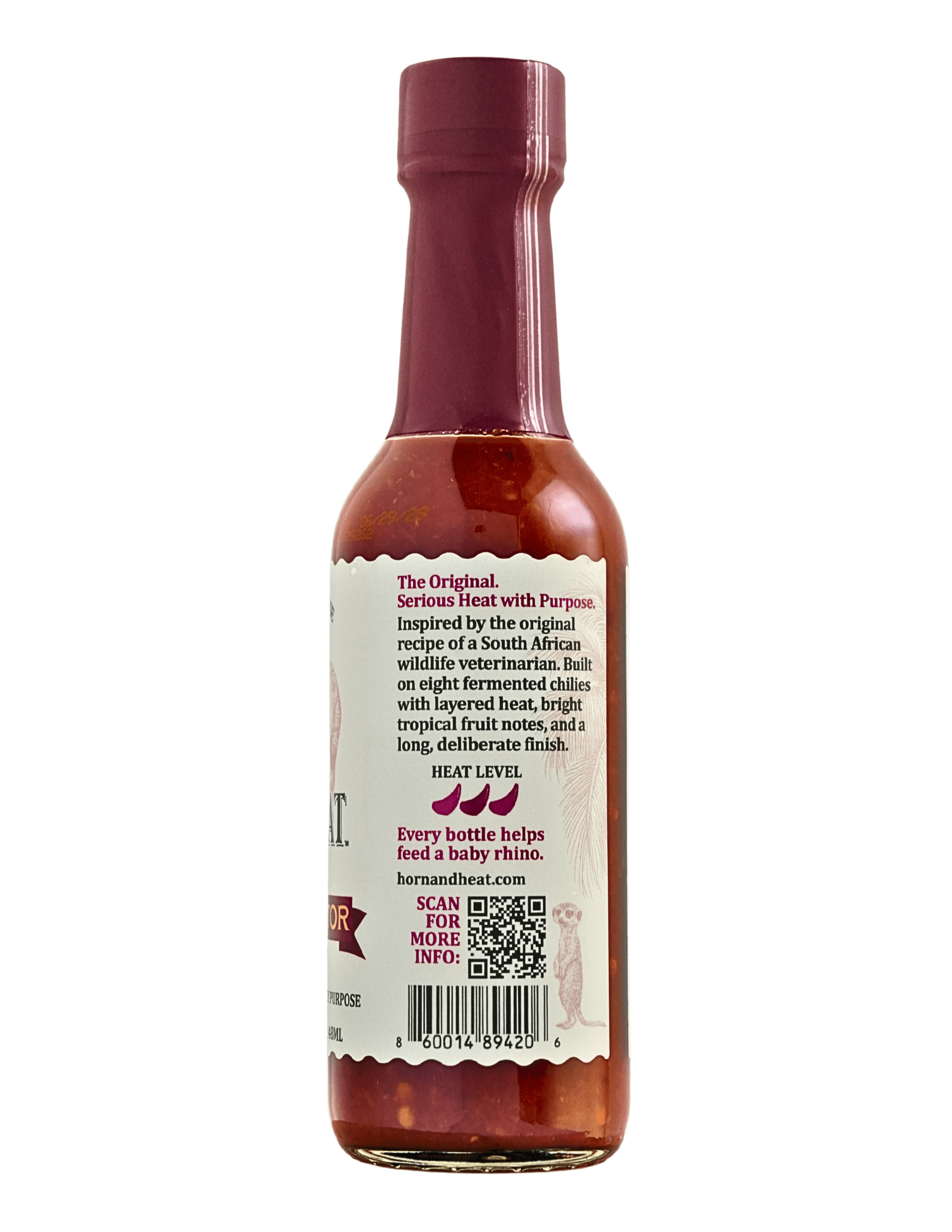Bottle of Rhino Gold Hot Sauce showcasing the label with description and heat level information.